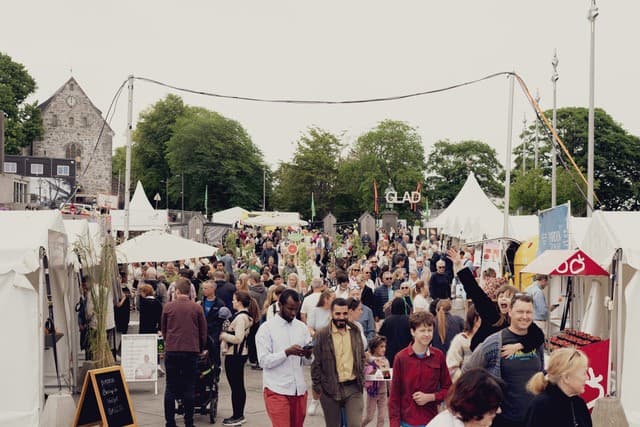 People on the food festival Gladmat in Stavanger either serving food or guests eating food