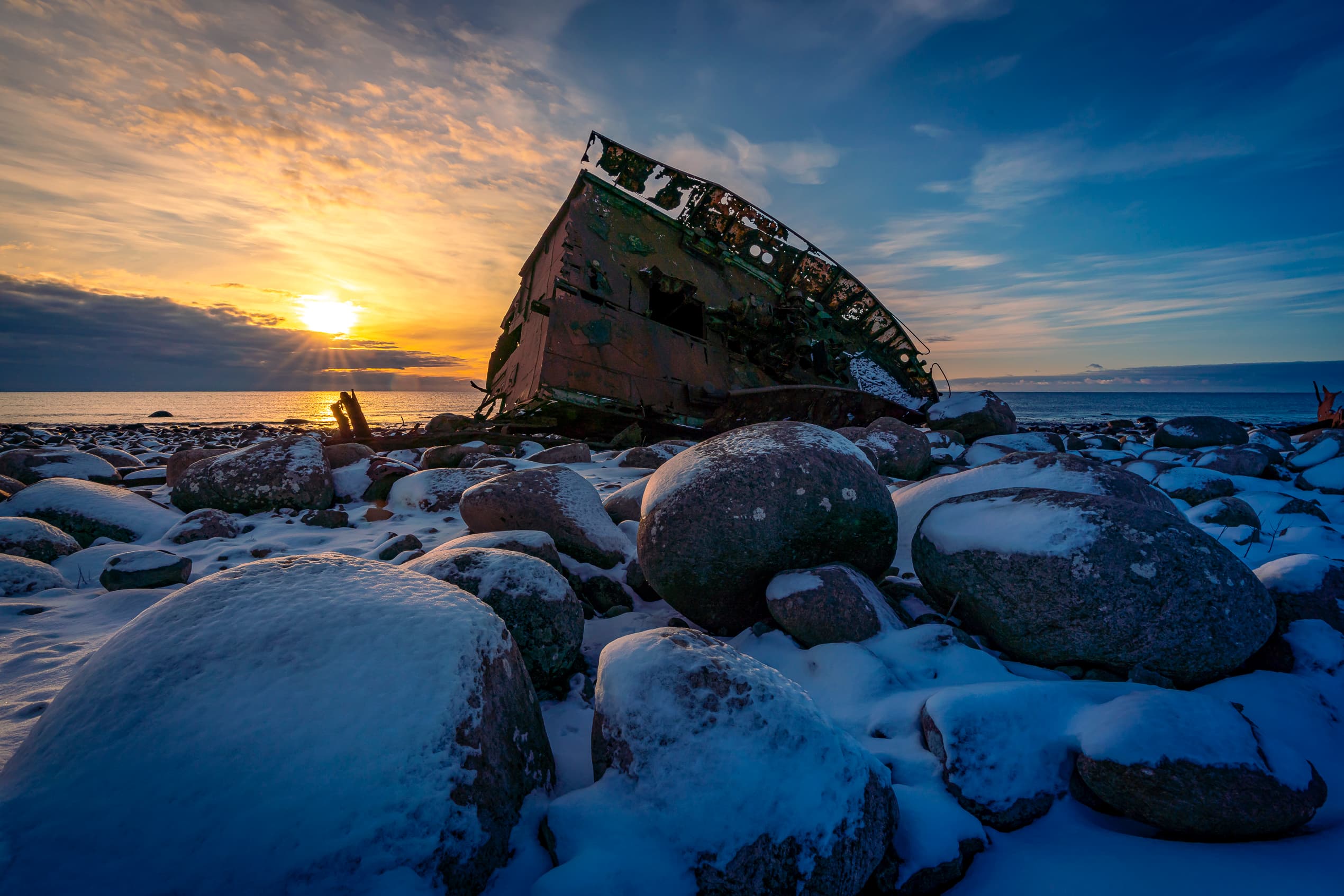madland harbour in sunset and in winter with snow