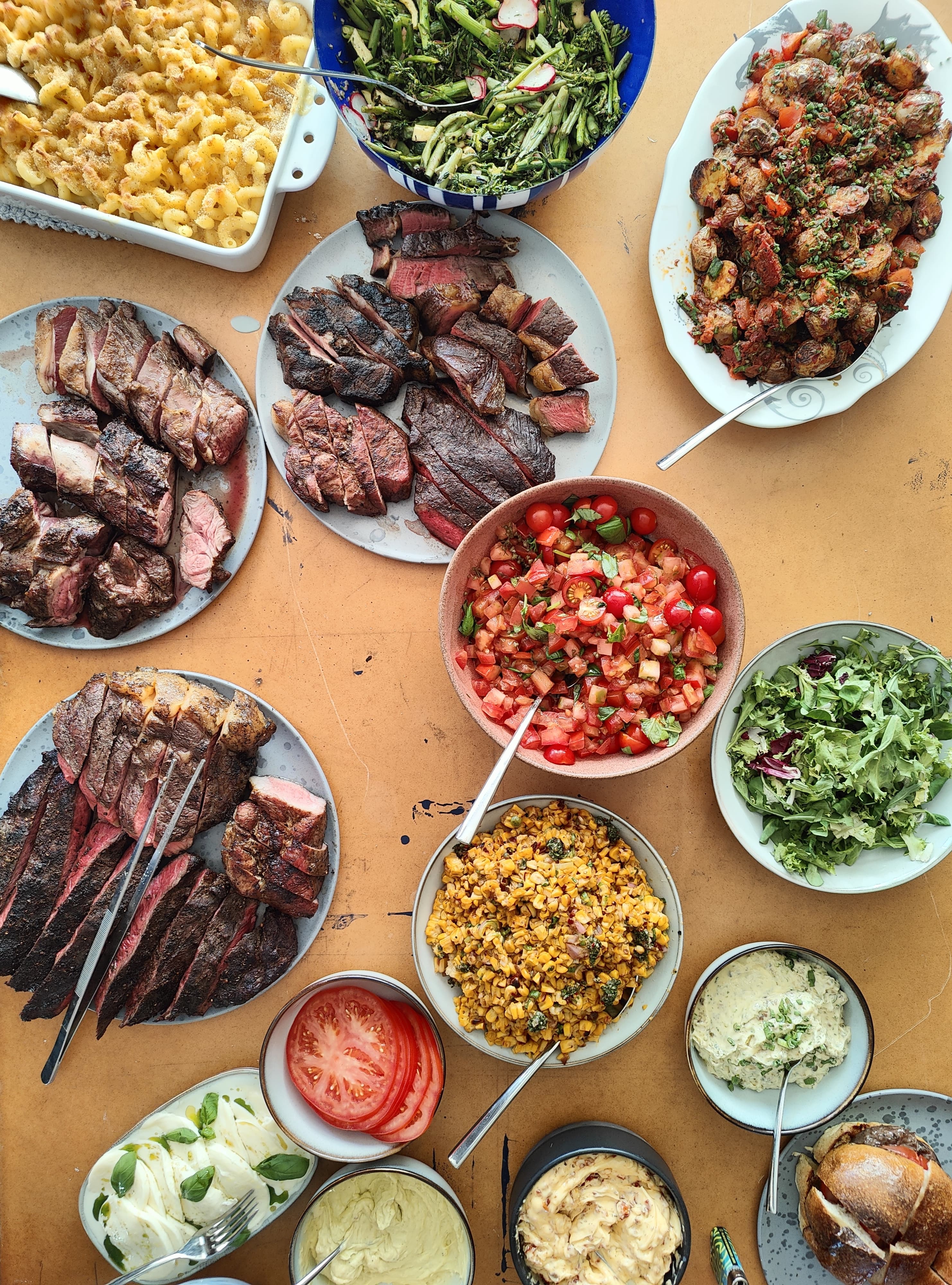 A table of food platters with meat and vegetable dishes from Nyyyt, Røysland Gård farm outlet and restaurant