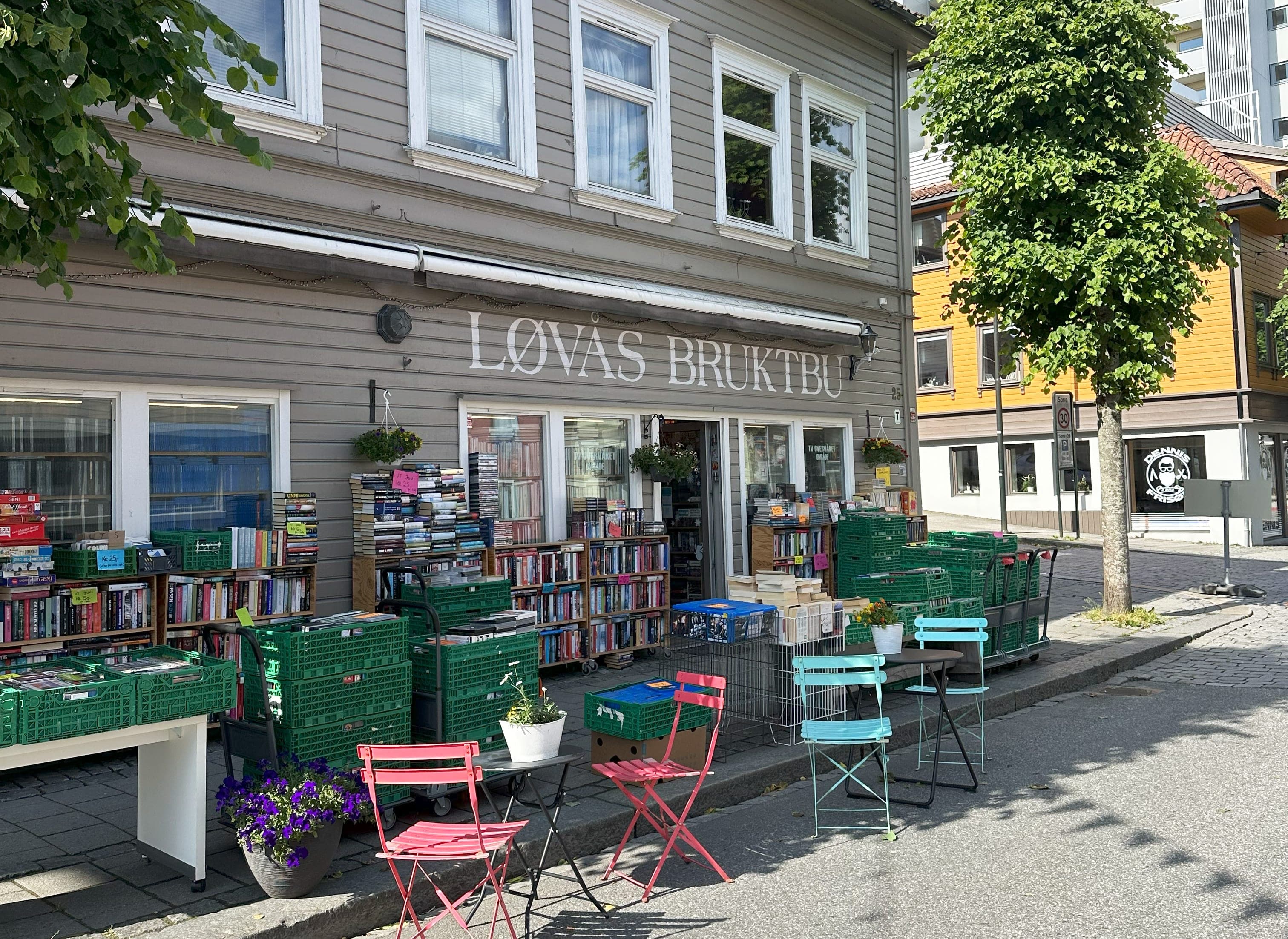 Facade of second hand book shop in the street pedersgata in stavanger. Colourful outdoor seating and display of books outside the shop