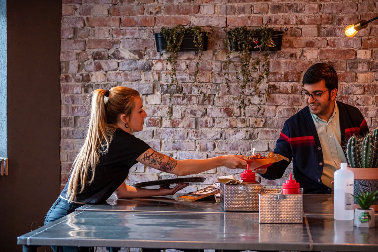 Restaurant, burger, people being served at the burger restaurant