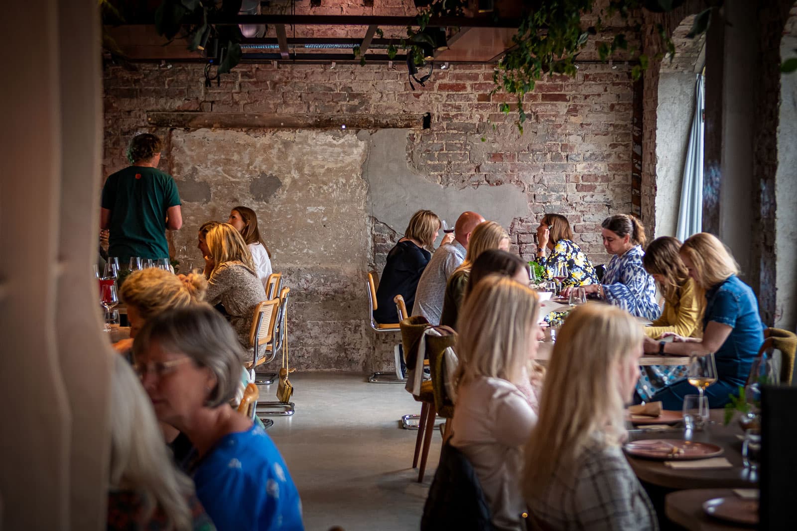 Food and people eating at restaurant Bellies - vegan restaurant