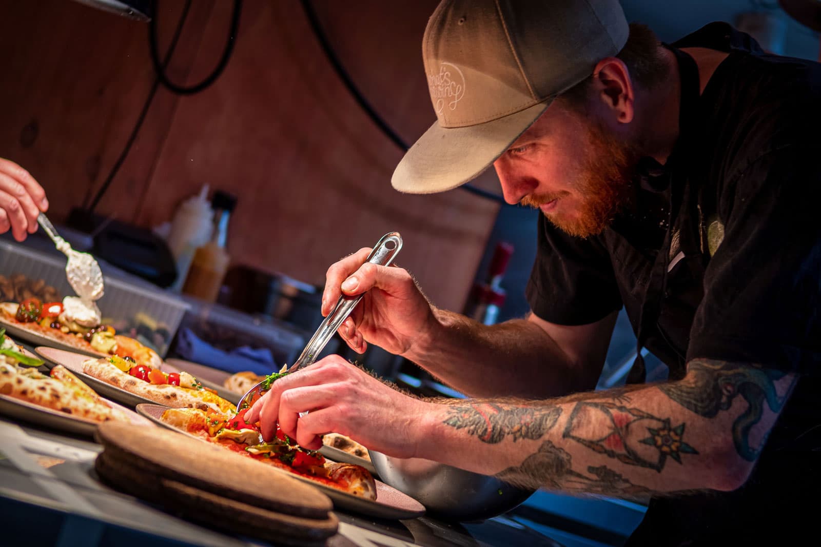 Food and people eating at restaurant Bellies - vegan restaurant