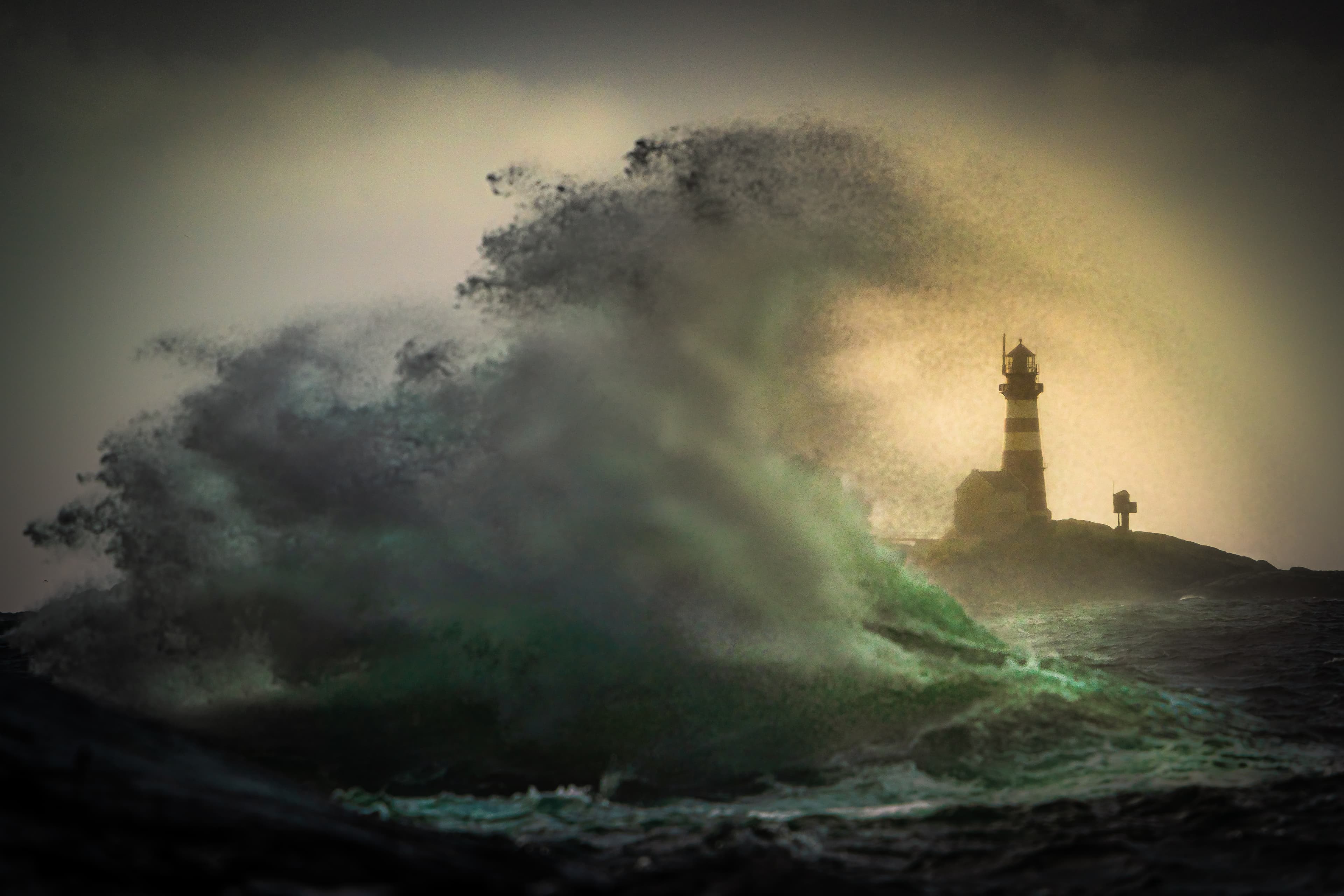 Stormy sea in front of lighthouse