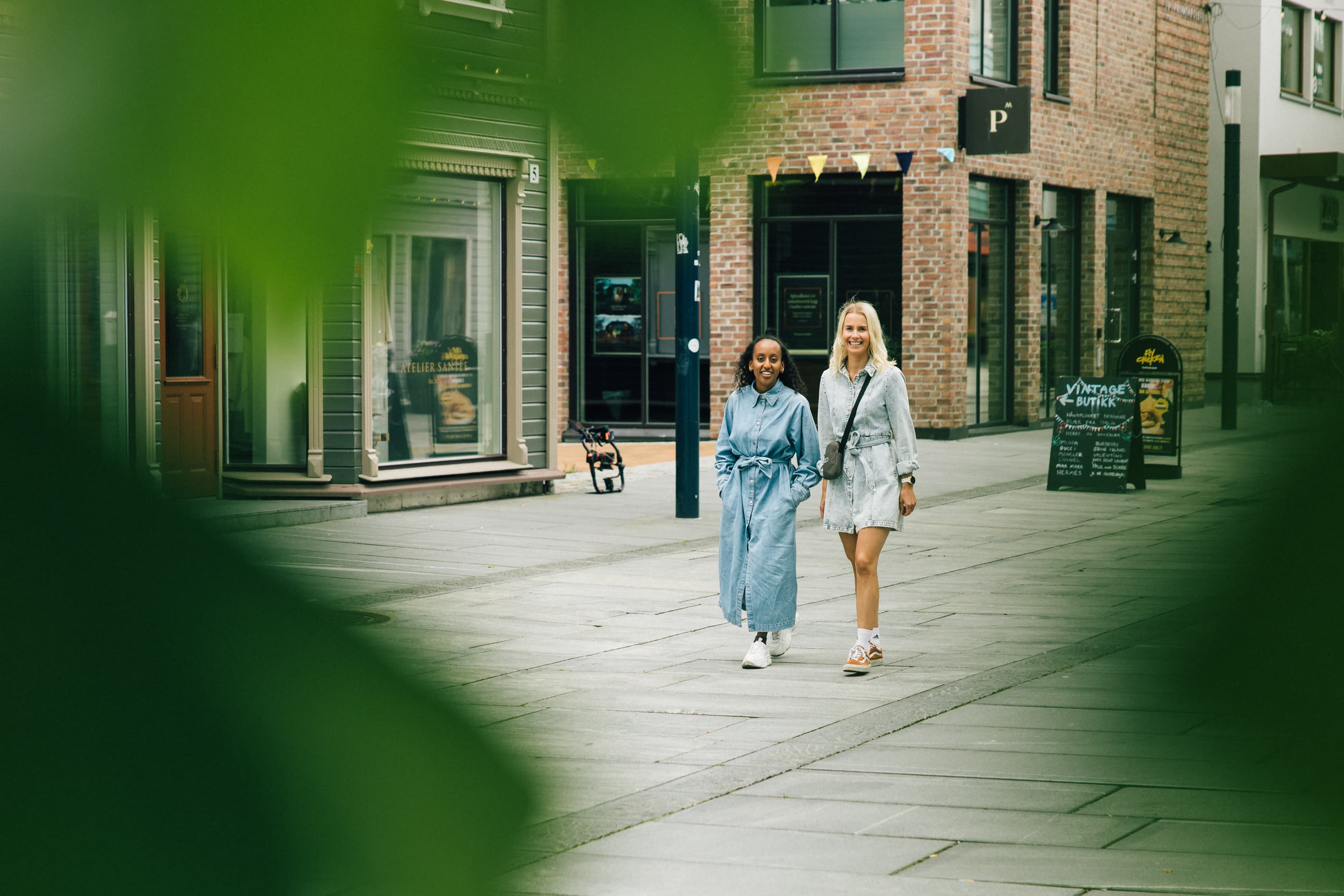 Two women walking in the shopping street in Sandnes, Langgata
