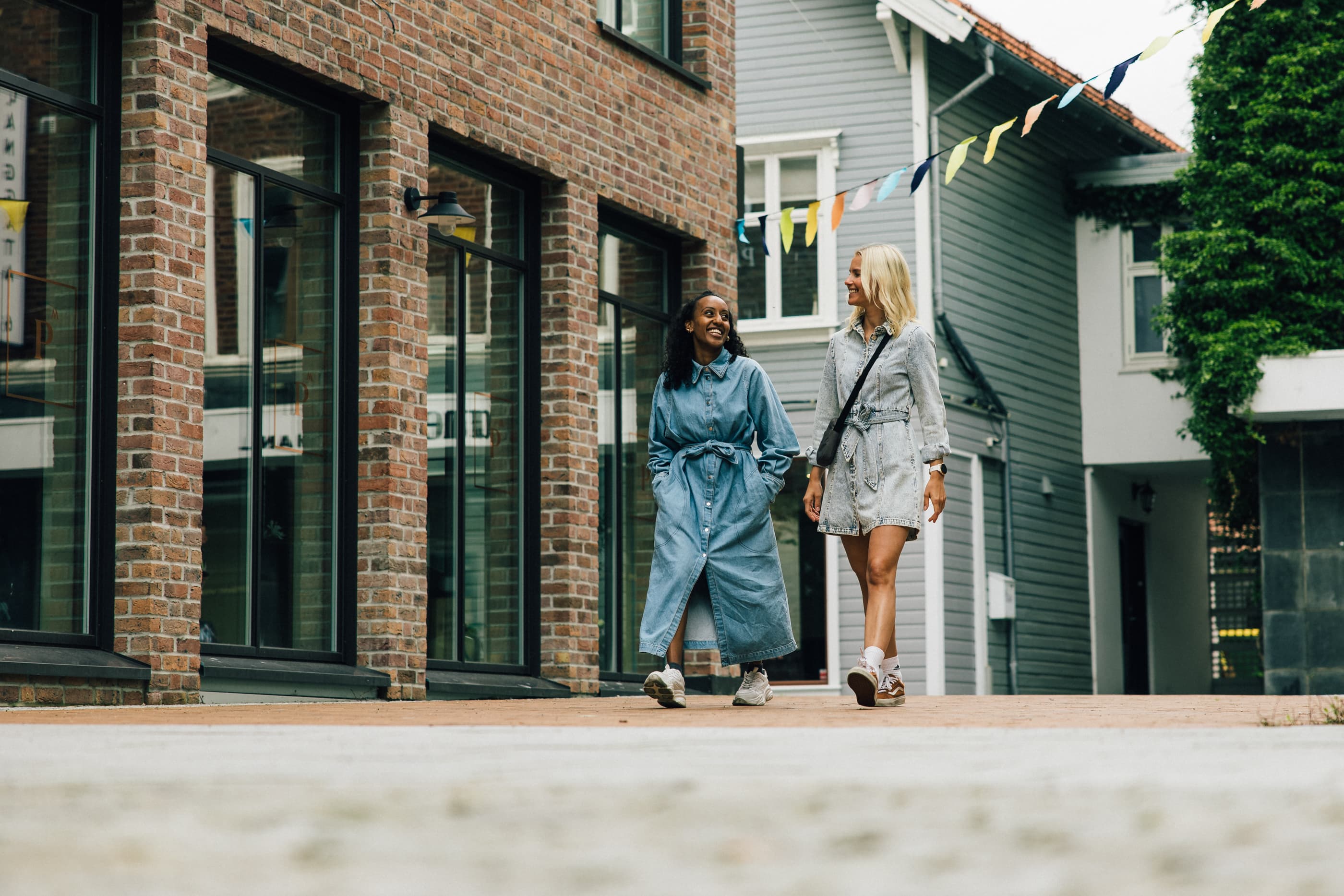 Two women walking in the shopping street in Sandnes, Langgata