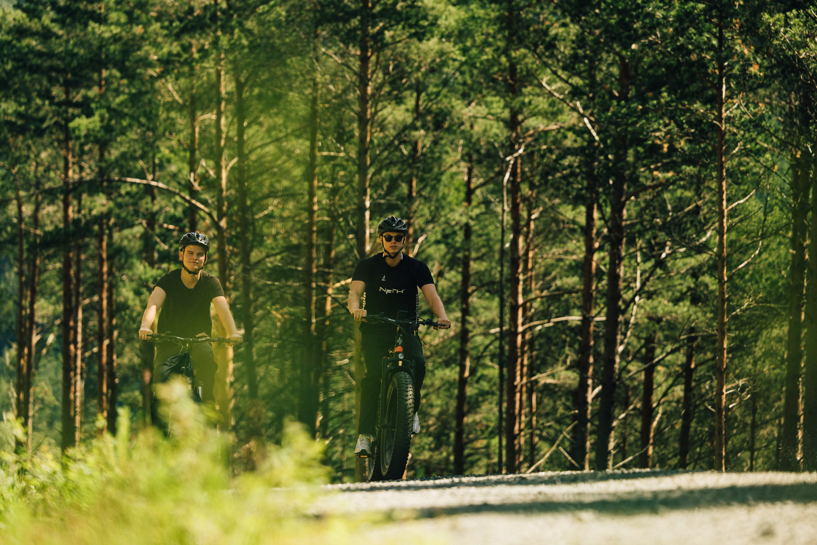 Two men cycling or hiking to mountain uburen in sandnes