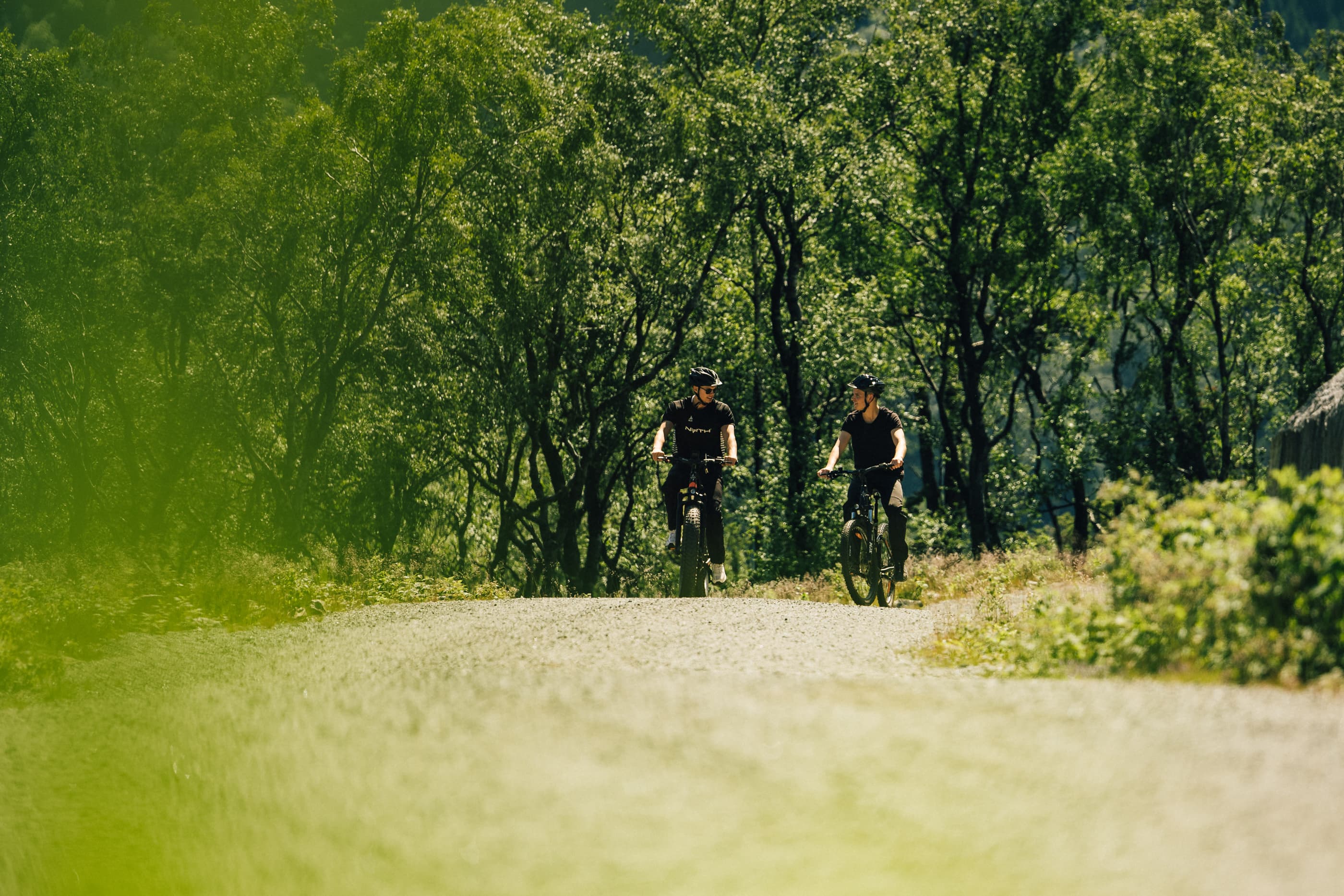 Two men cycling or hiking to mountain uburen in sandnes