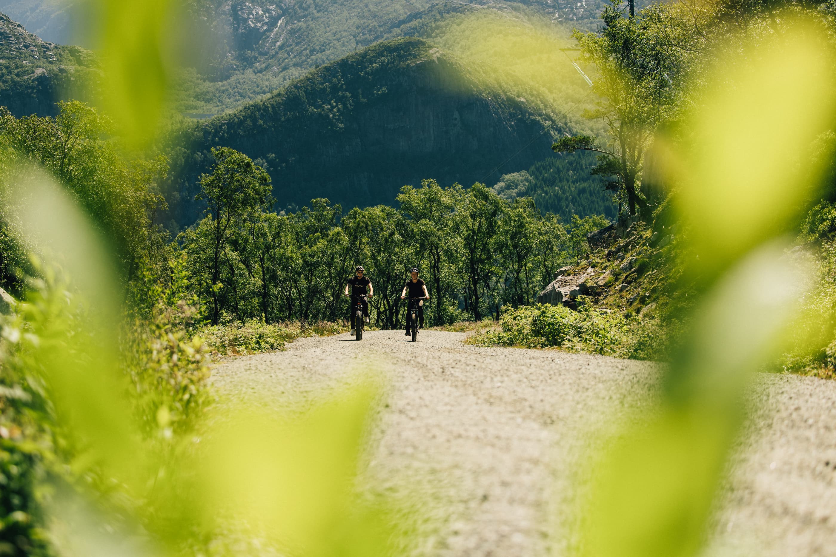 Two men cycling or hiking to mountain uburen in sandnes