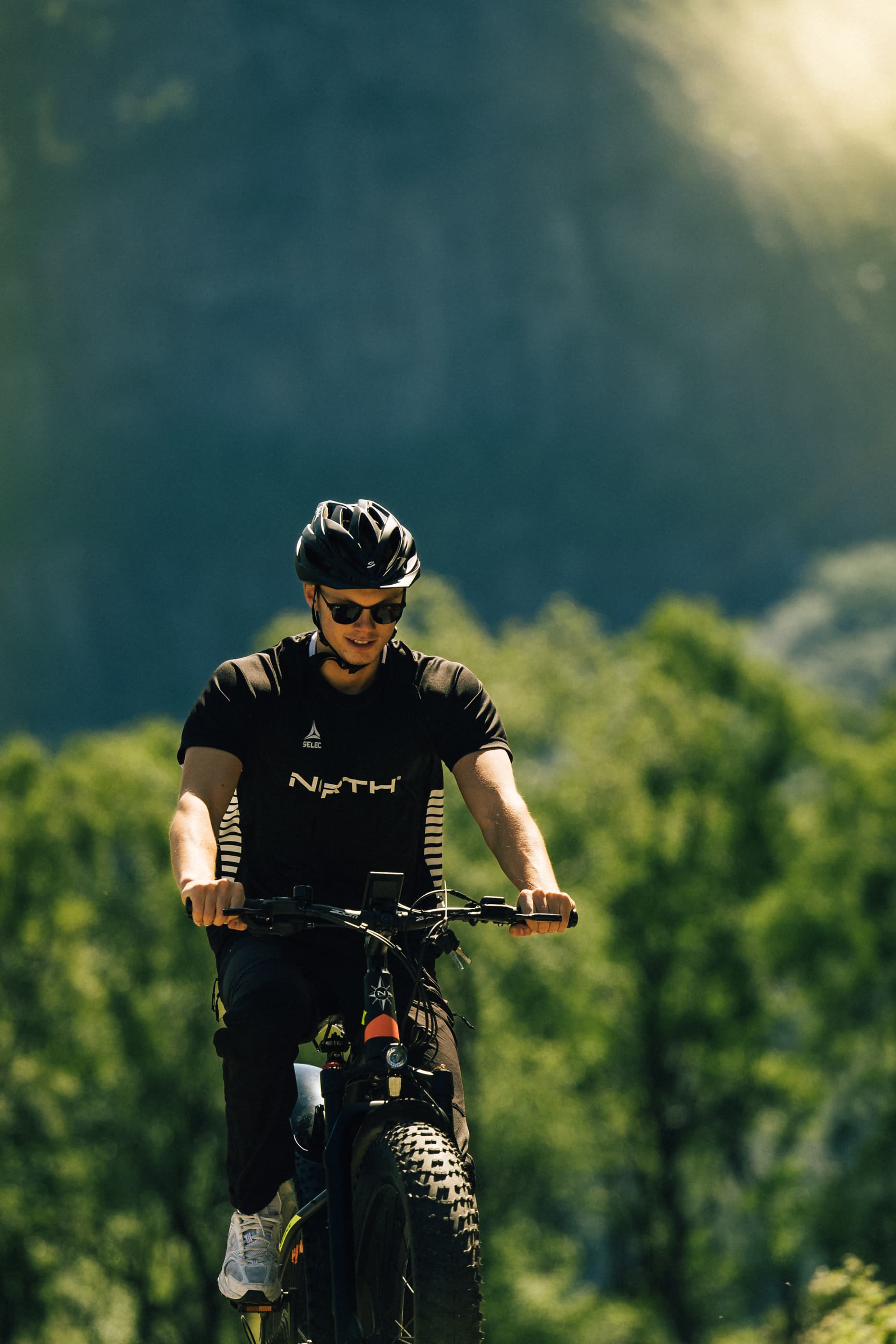 Two men cycling or hiking to mountain uburen in sandnes