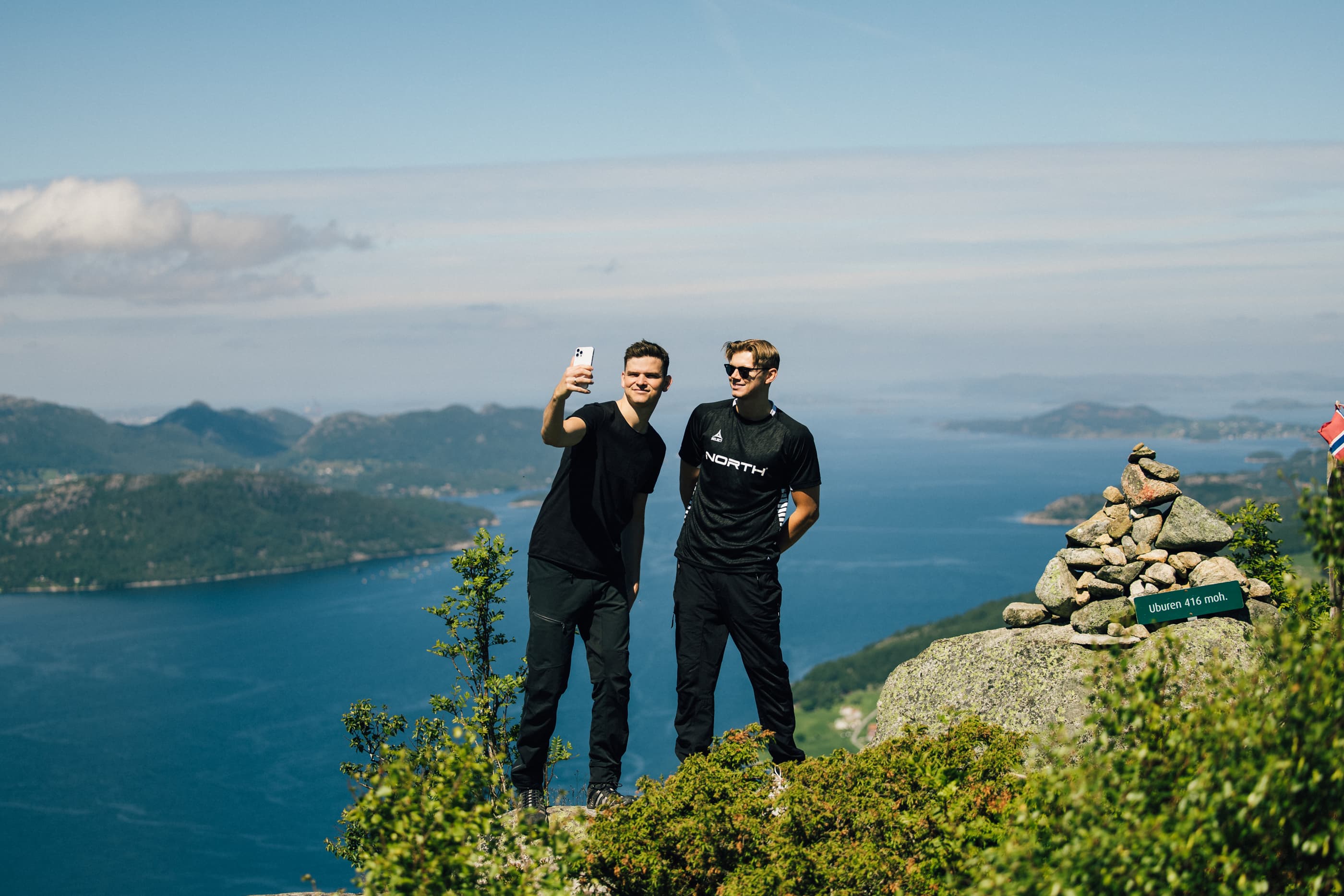 Two men cycling or hiking to mountain uburen in sandnes