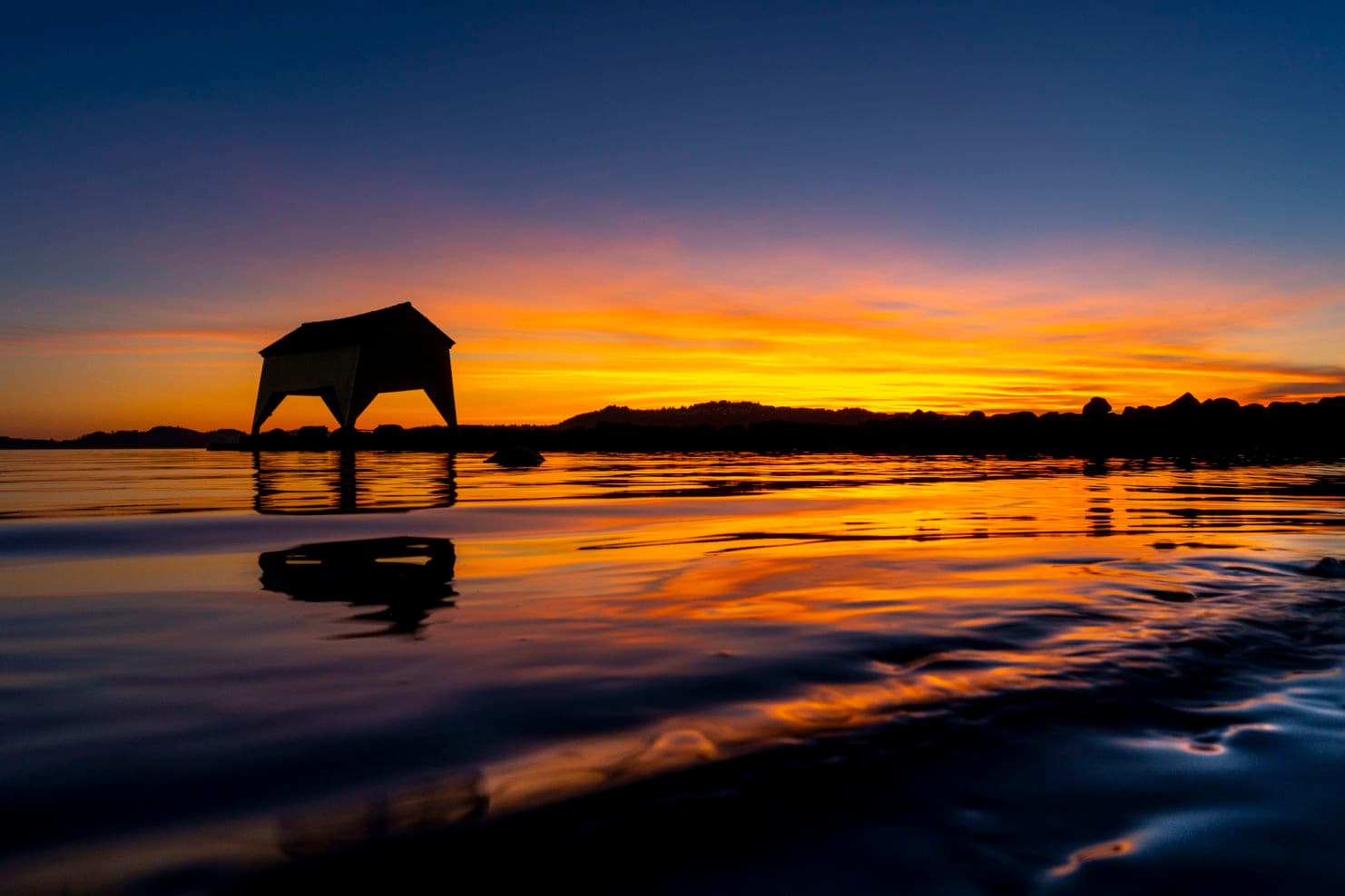 A boathouse in the sunset