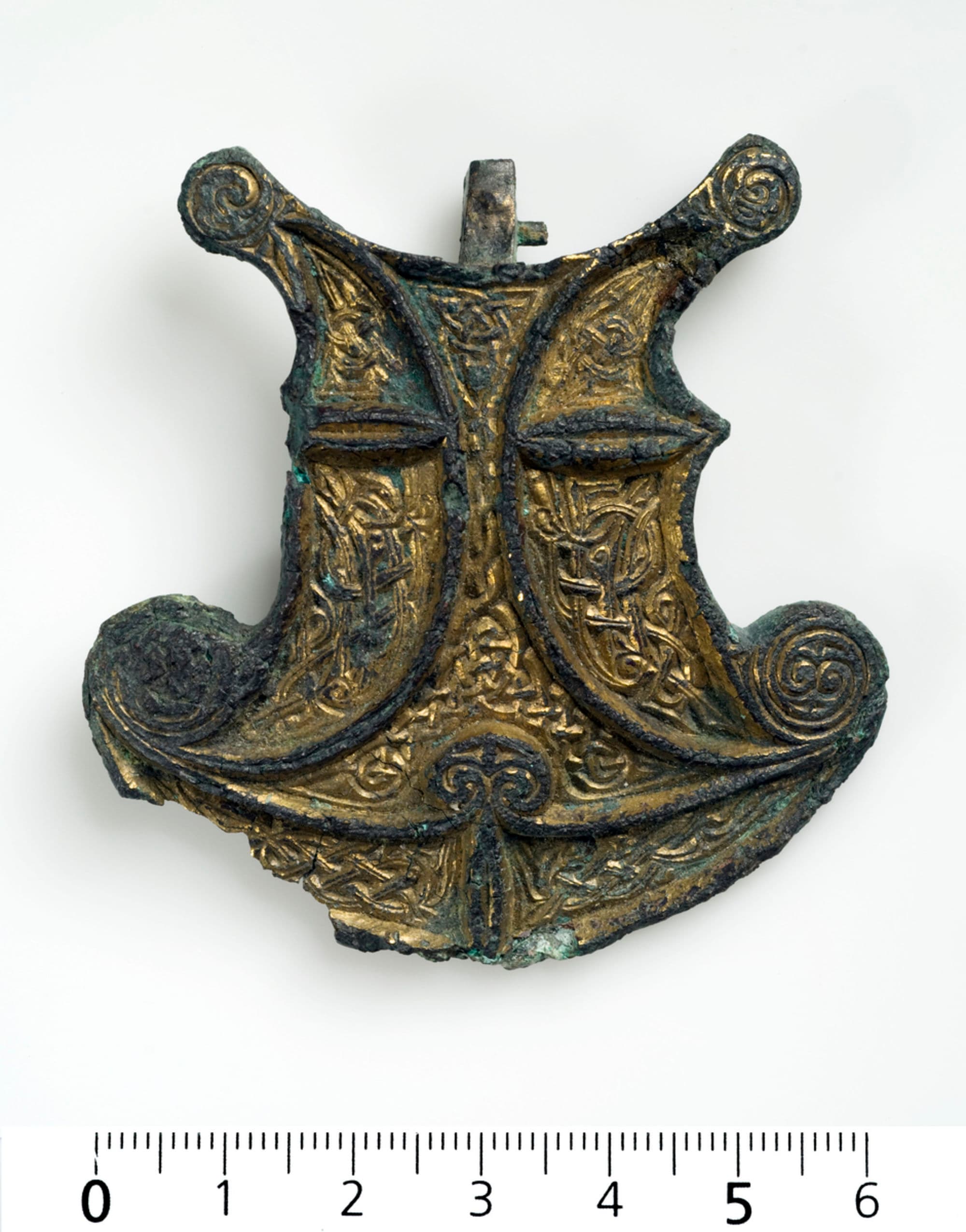 Four-sided copper and gold fittings from the Viking Age