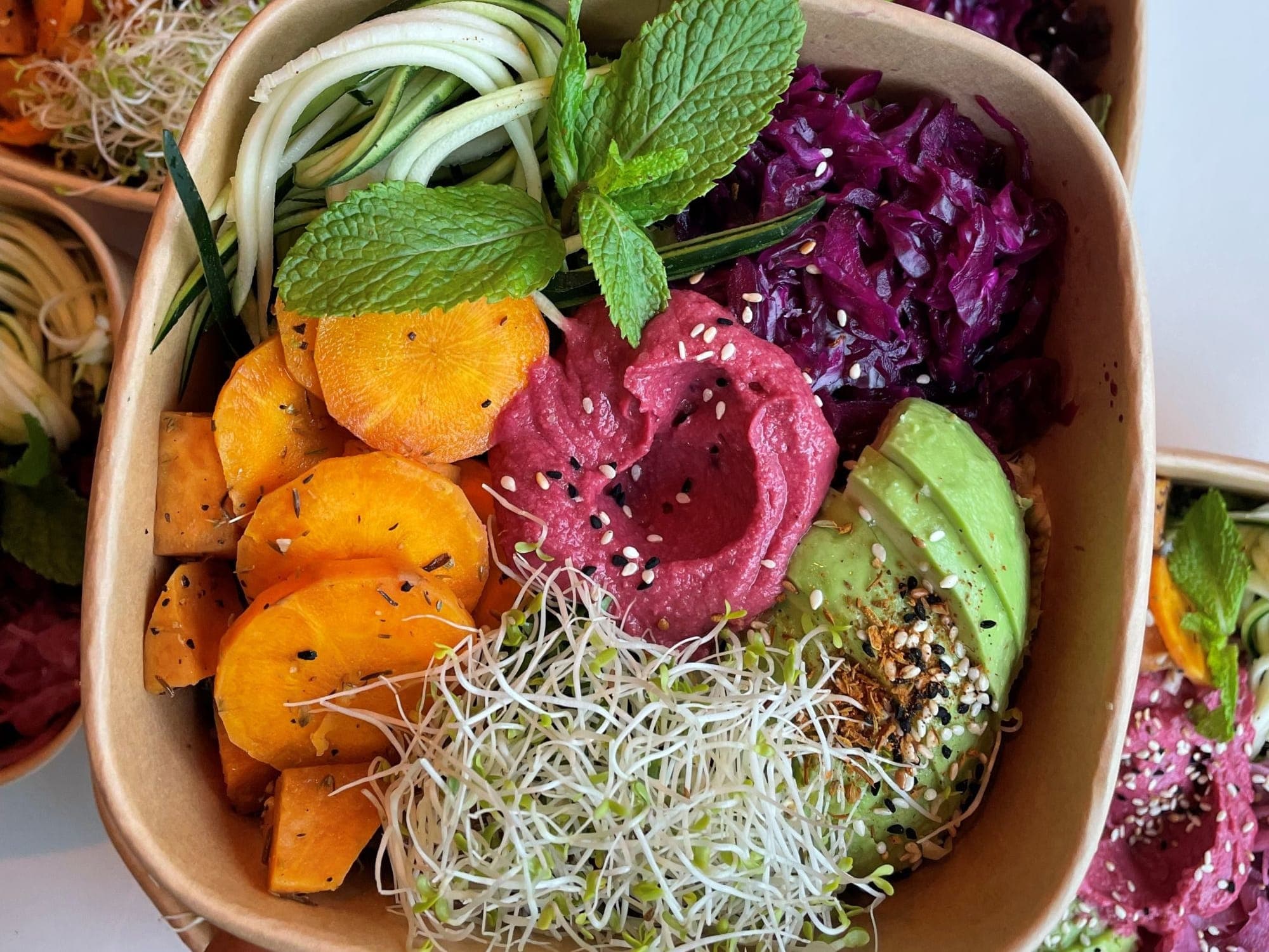 A bowl of food - showing fresh vegetables with vibrant colours