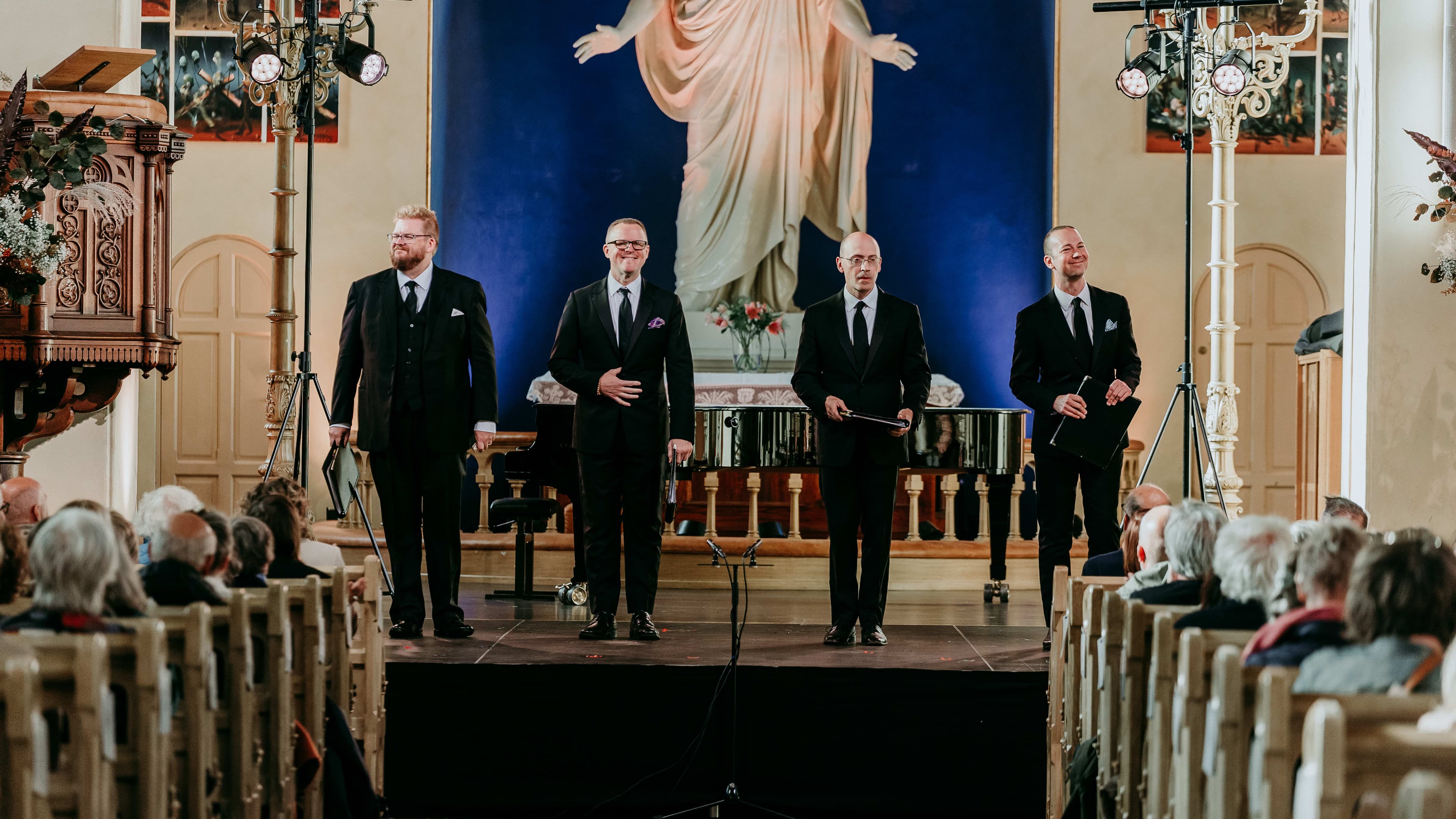 Four men singing from church stage at the Kammermusikkfestivalen Stavanger