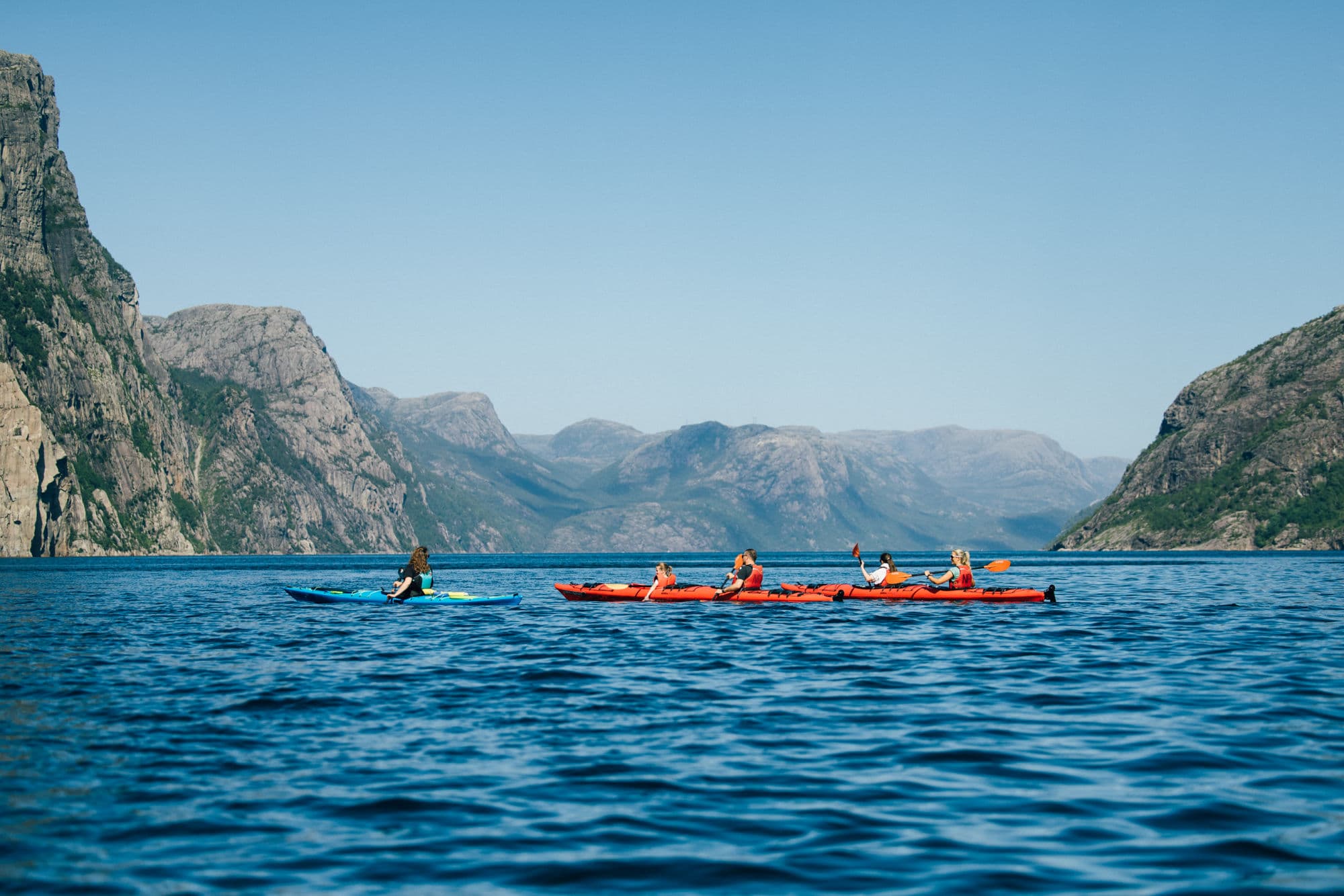 People kayaking in the Norwegian fjords