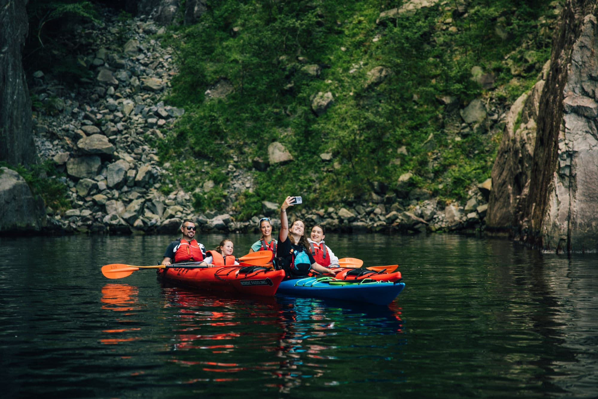 People kayaking in the Norwegian fjords