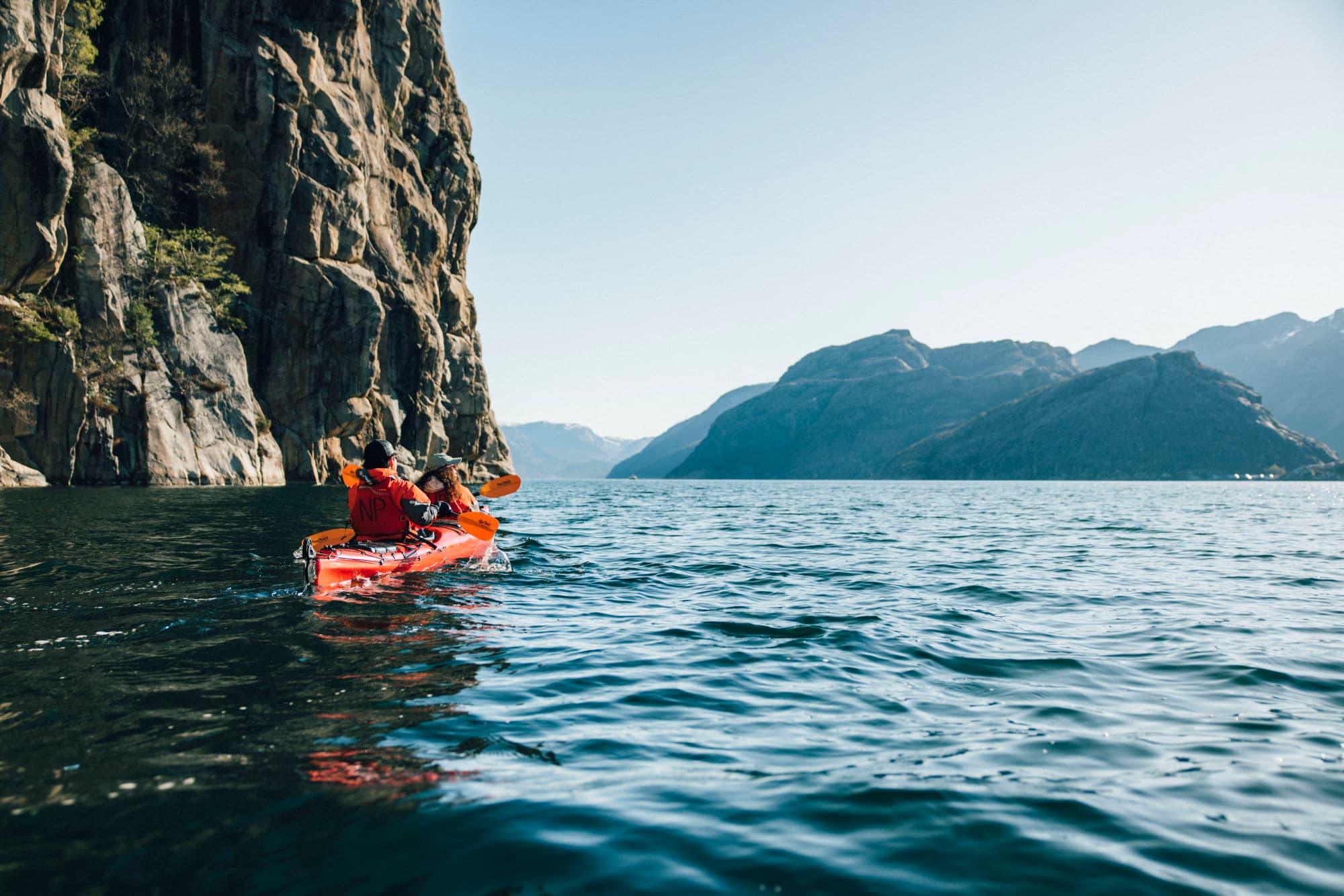 People kayaking in the Norwegian fjords