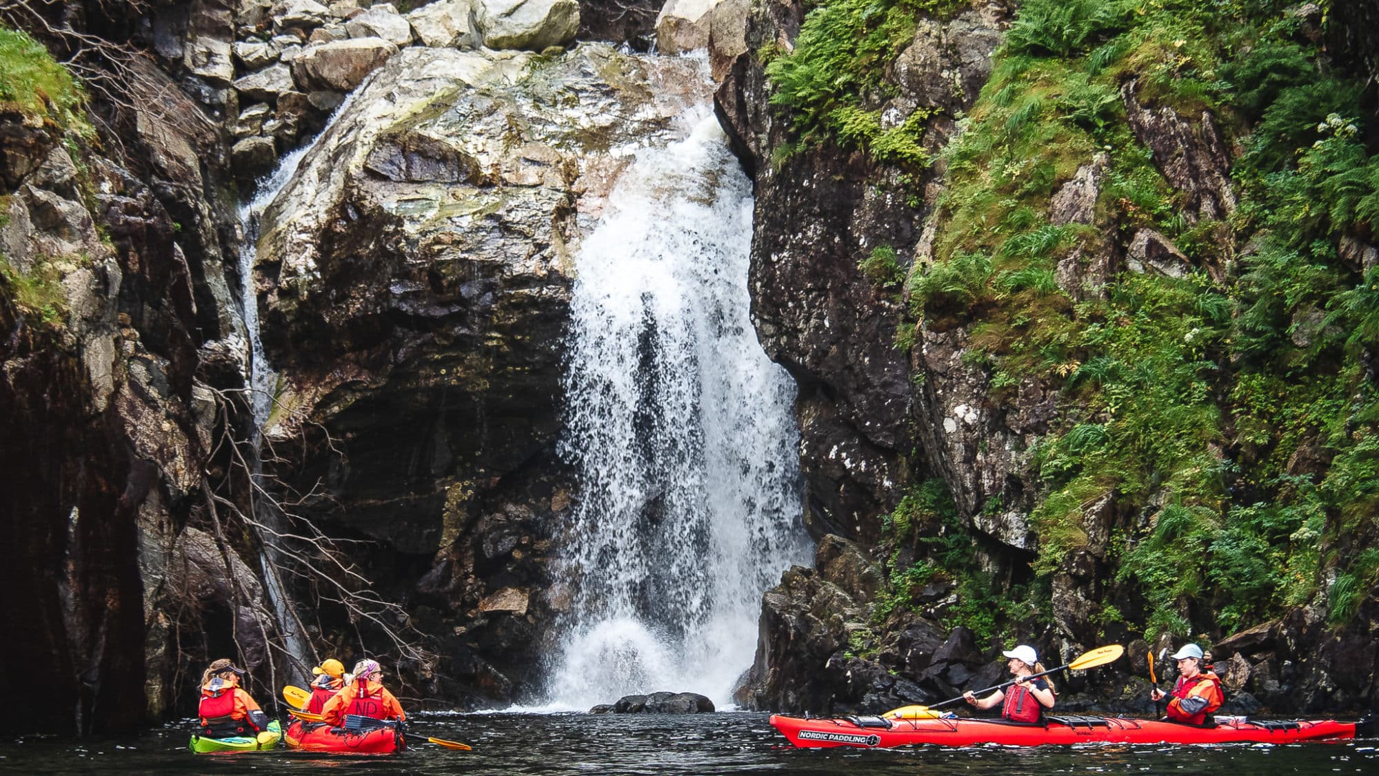 People kayaking in the Norwegian fjords