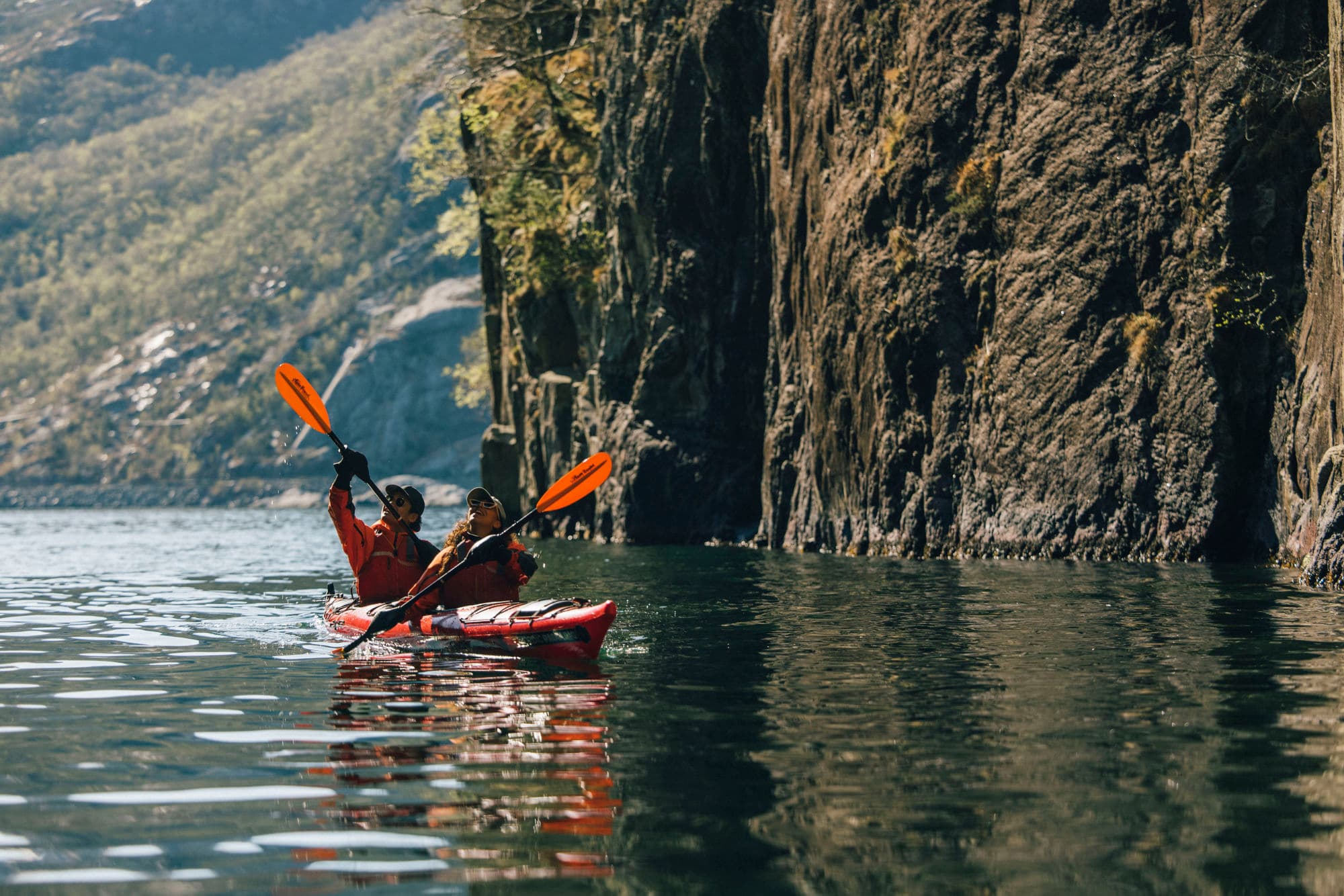 People kayaking in the Norwegian fjords
