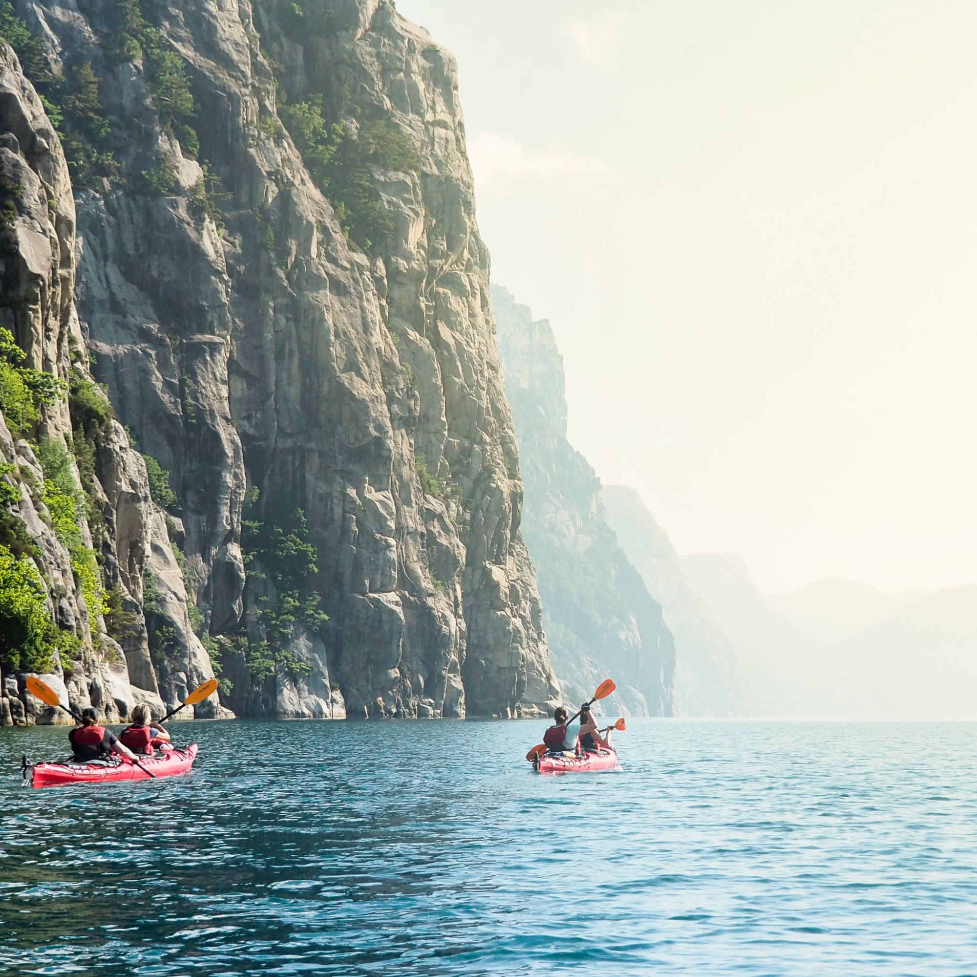 People kayaking in the Norwegian fjords