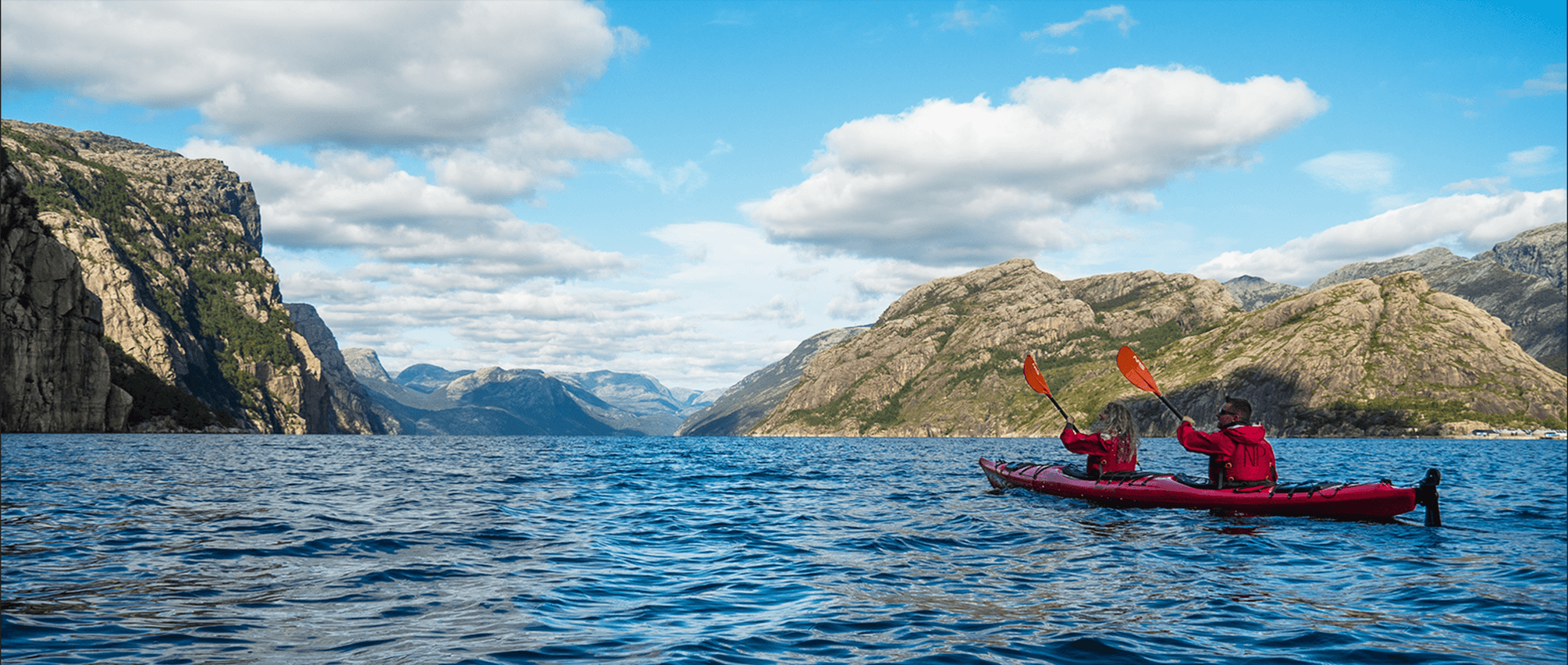 People kayaking in the Norwegian fjords