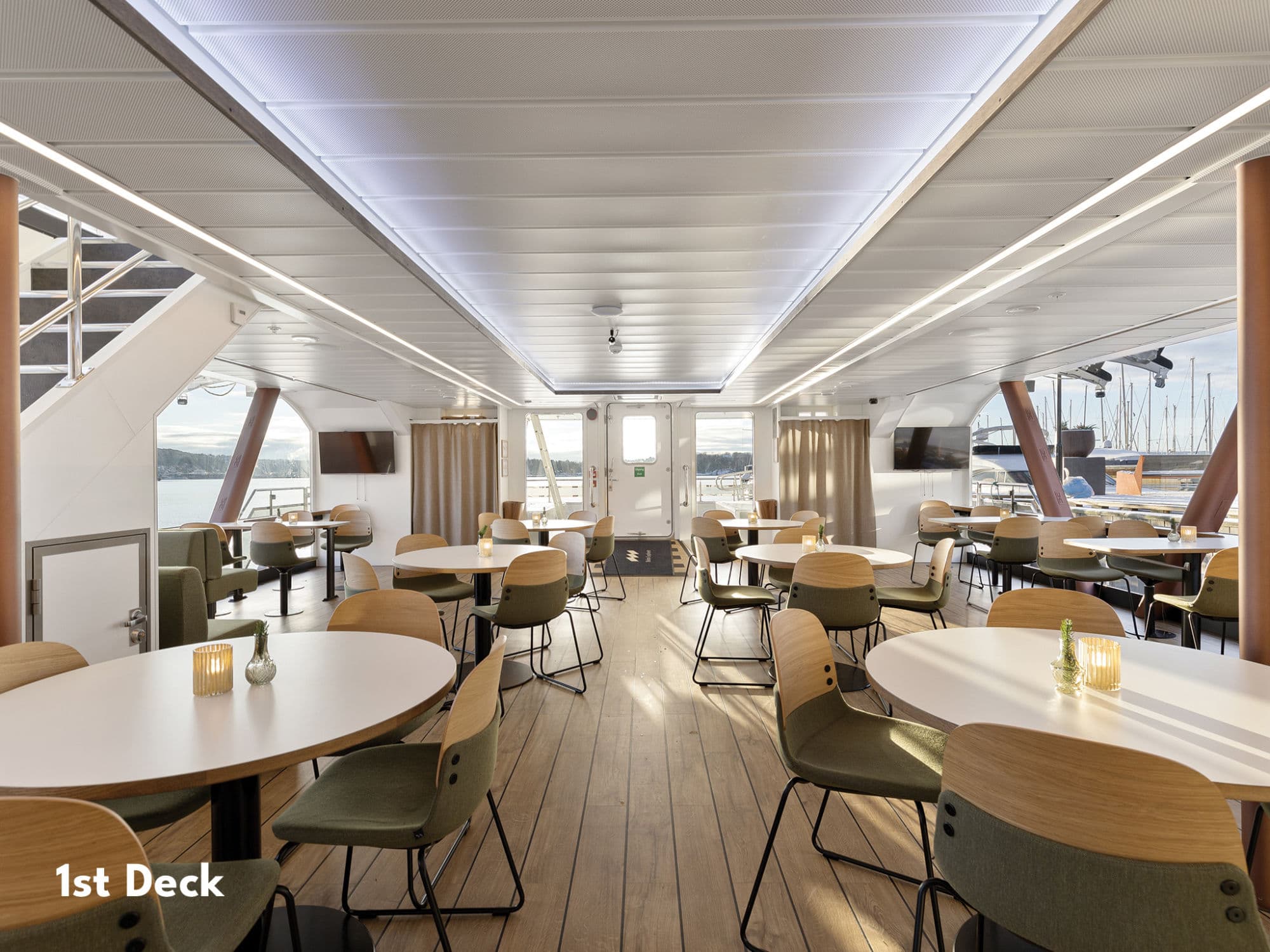 interior boat, plates of food, people on fjord cruise evening with dinner