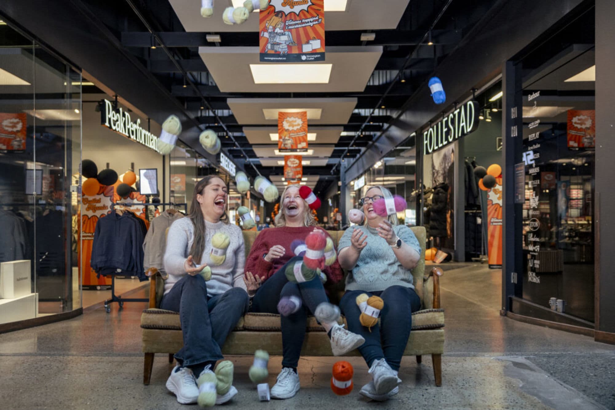 People shopping or in clothing from brandshops at Norwegian Outlet