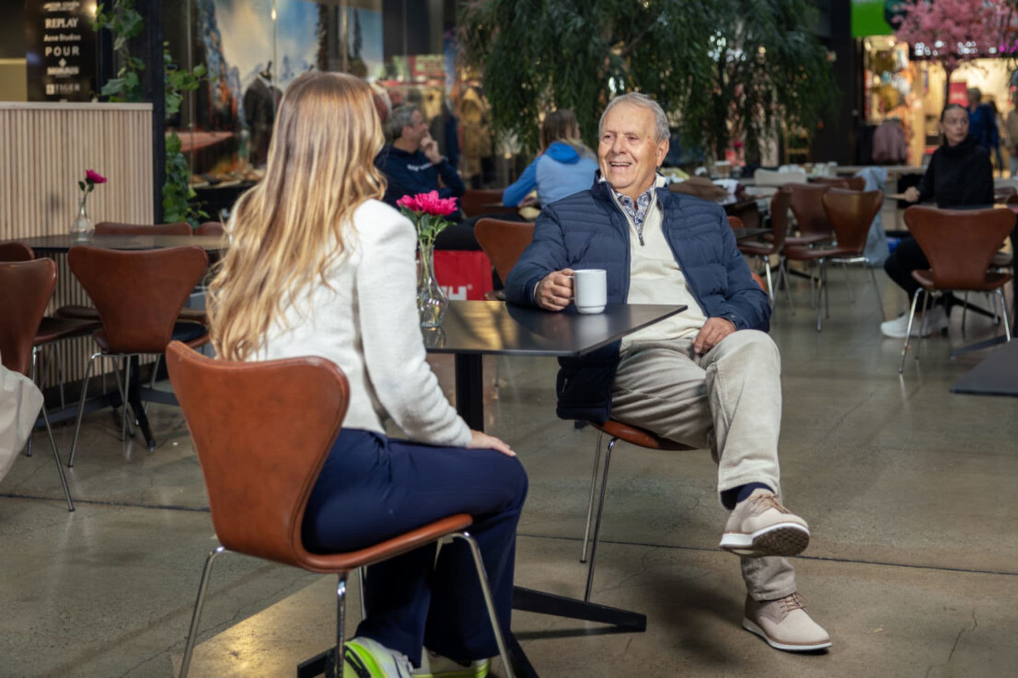 People shopping or in clothing from brandshops at Norwegian Outlet