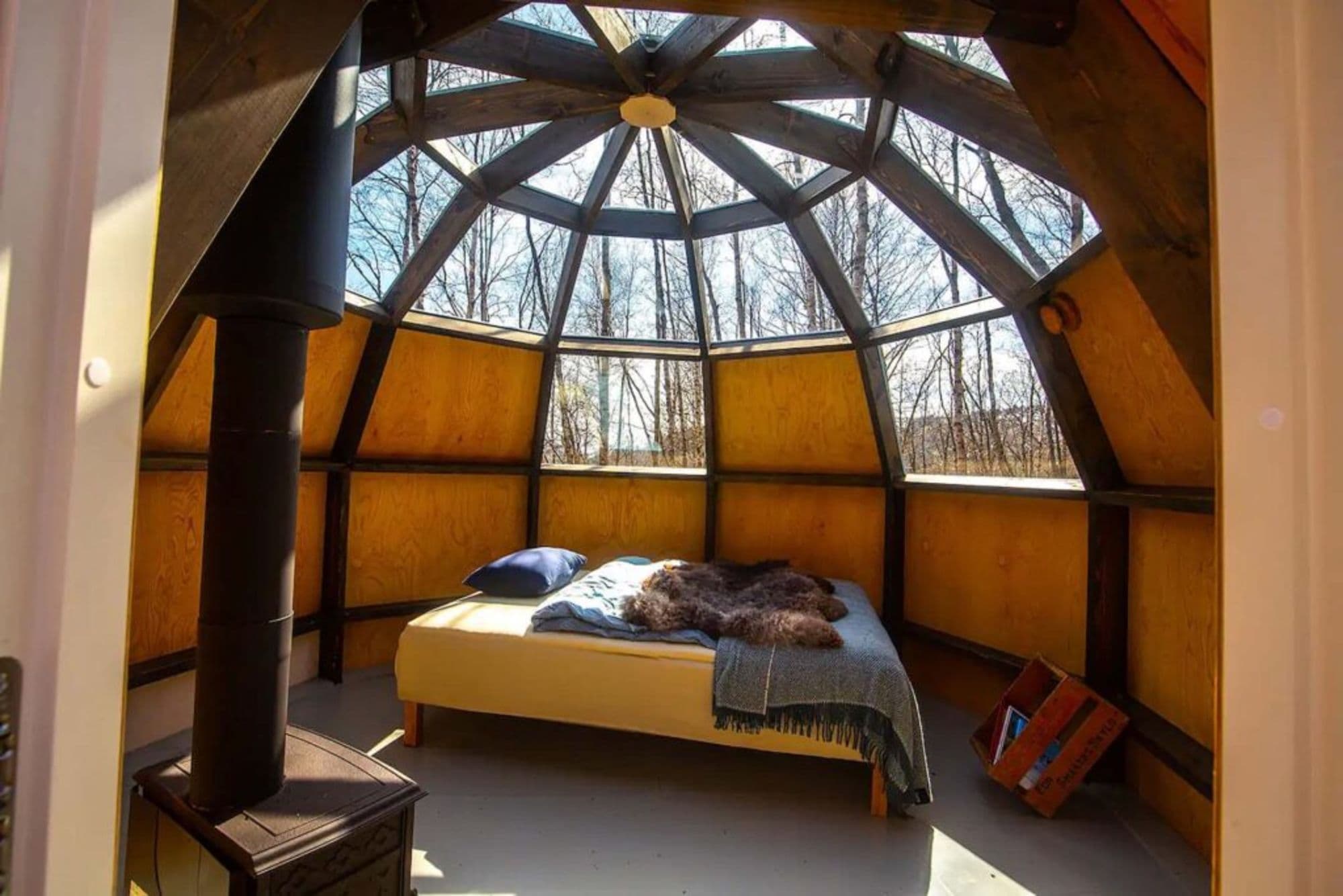 inside the ecolodge, bed and windows with view of stars