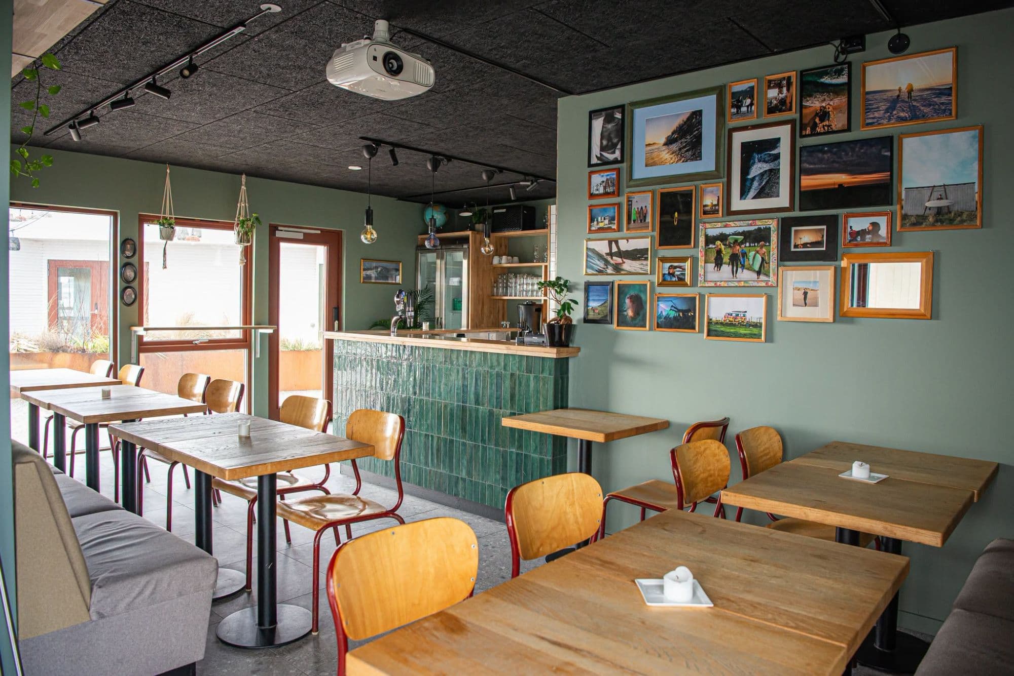cafe interior with tables, chairs and bar and serving counter
